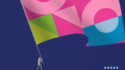 A small image of a person holding a giant flag with BE-branded geometric shapes