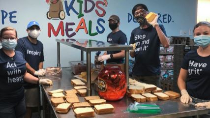 The BrandExtract team makes sandwiches at Kids' Meals Inc. for impoverished children.