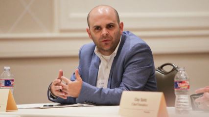 Chris Wilks speaking at the 2019 Presidential Forum.