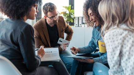 Group of people meeting and holding a discussion