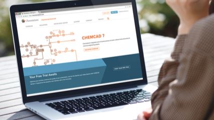 An over-the-shoulder image of a person looking at the Chemstations website on a laptop.