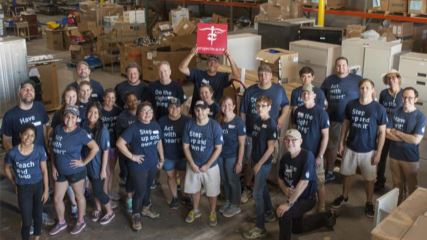 The BrandExtract team standing in the Project C.U.R.E. warehouse.
