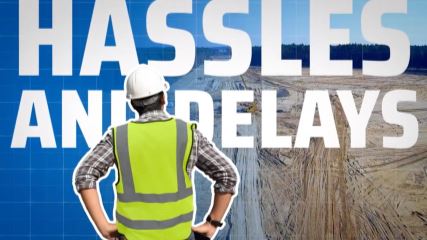 A screenshot from a WillScot video video with the super saying "Hassles and Delays".