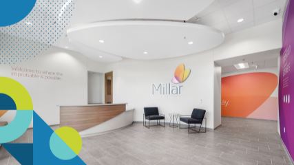 A photograph of Millar's office lobby with BE-branded shapes adorning the border