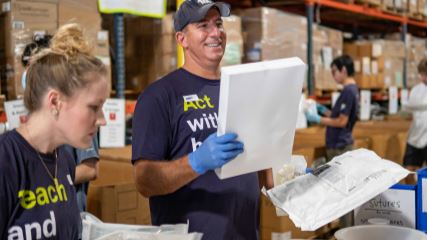 Bo and the BE Team sort supplies at Project C.U.R.E.