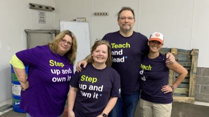 Jason, Malcolm, Bo, Rose and Lilli wearing gold medals after winning a company bowling competition