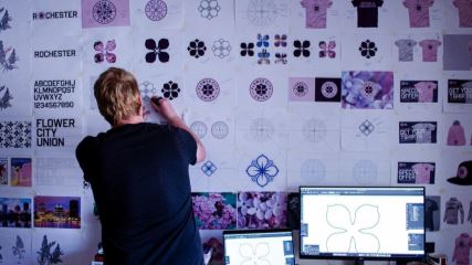 Chris Payne designing Flower City Union logo