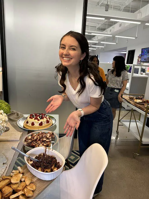 Maeghan showing off all the great sweets at a BrandExtract Finer Things Happy Hour