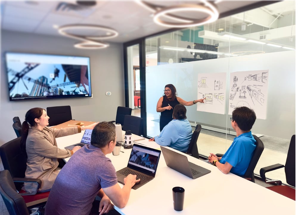 BrandExtract employees gathered in a creative meeting