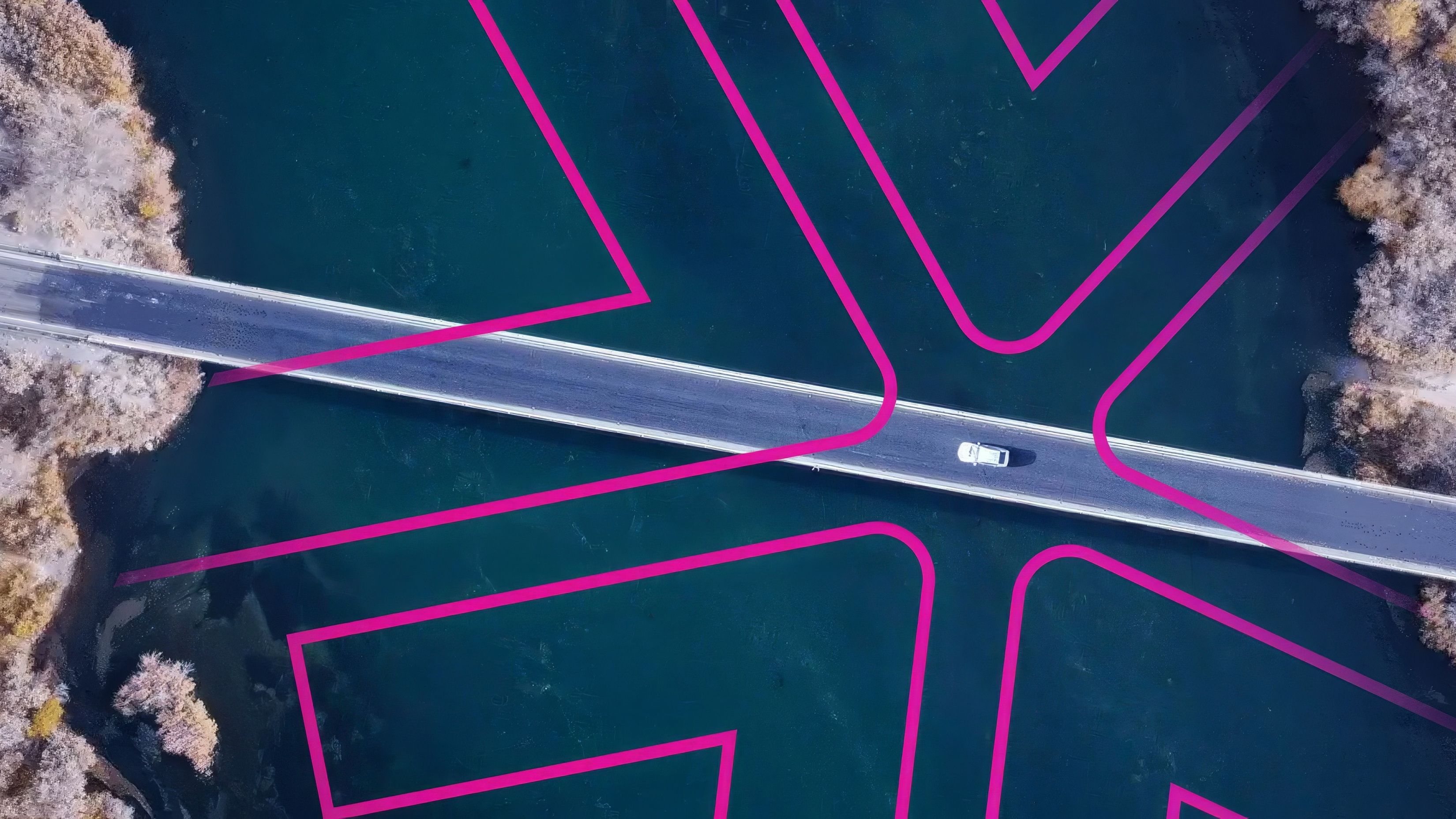The Lynkwell logo shown overlayed on top of a freeway following a car
